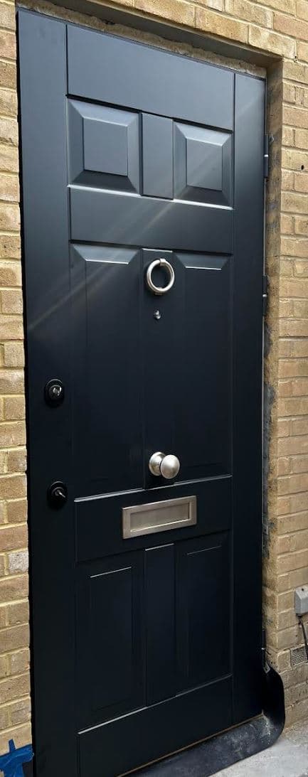Close-up of polished chrome ring knocker