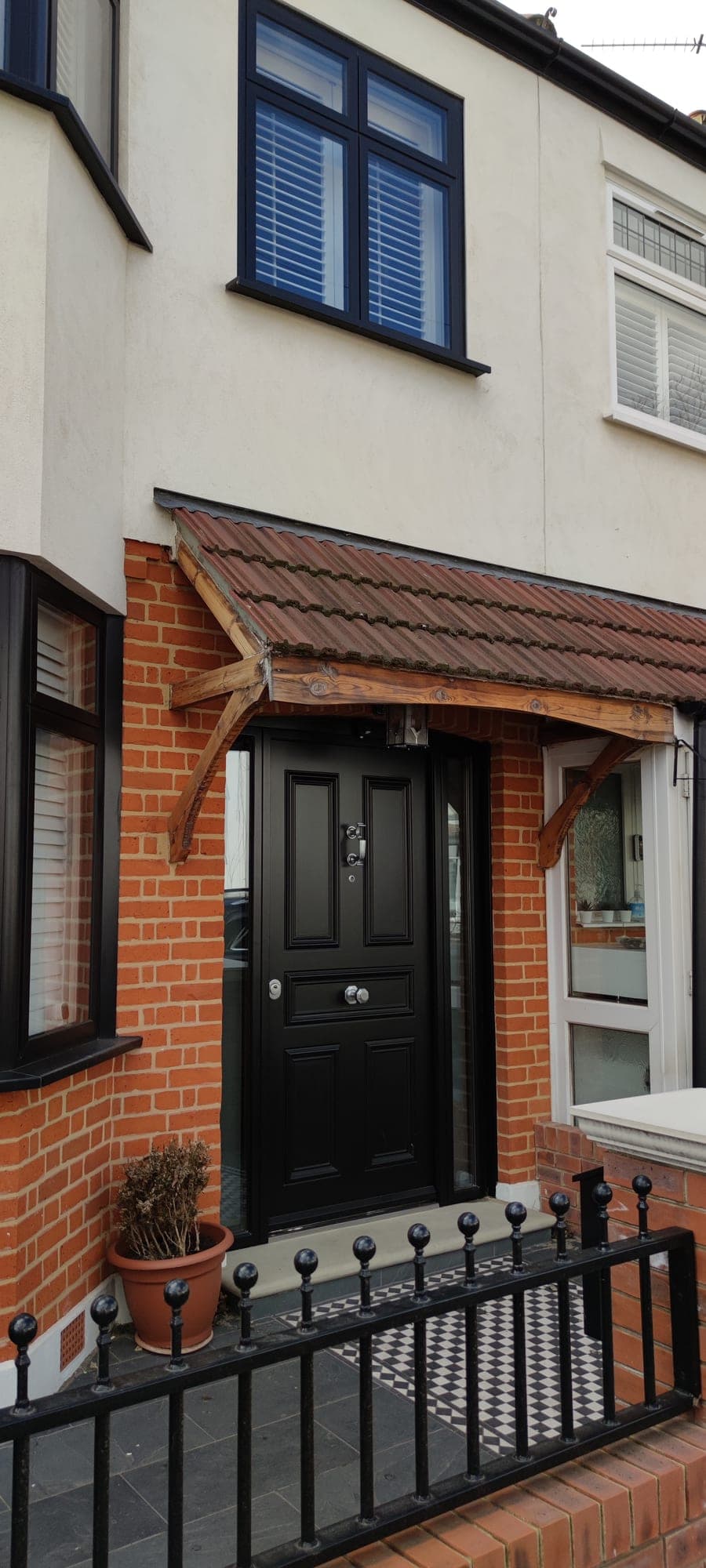 Black traditional under timber canopy