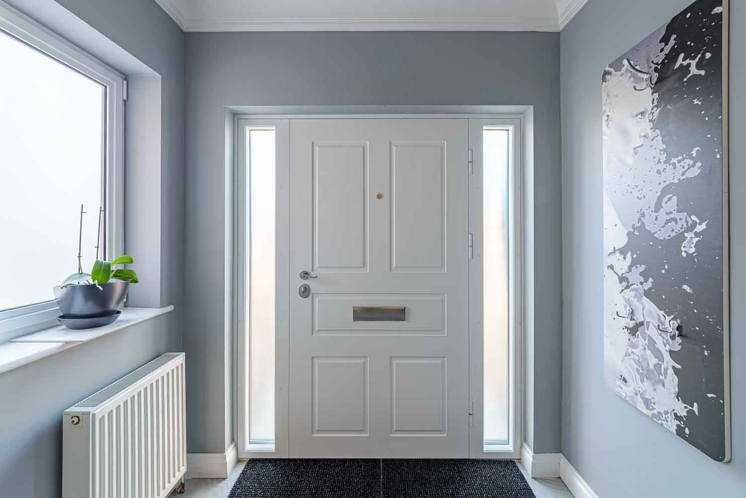 White panelled with sidelights hallway