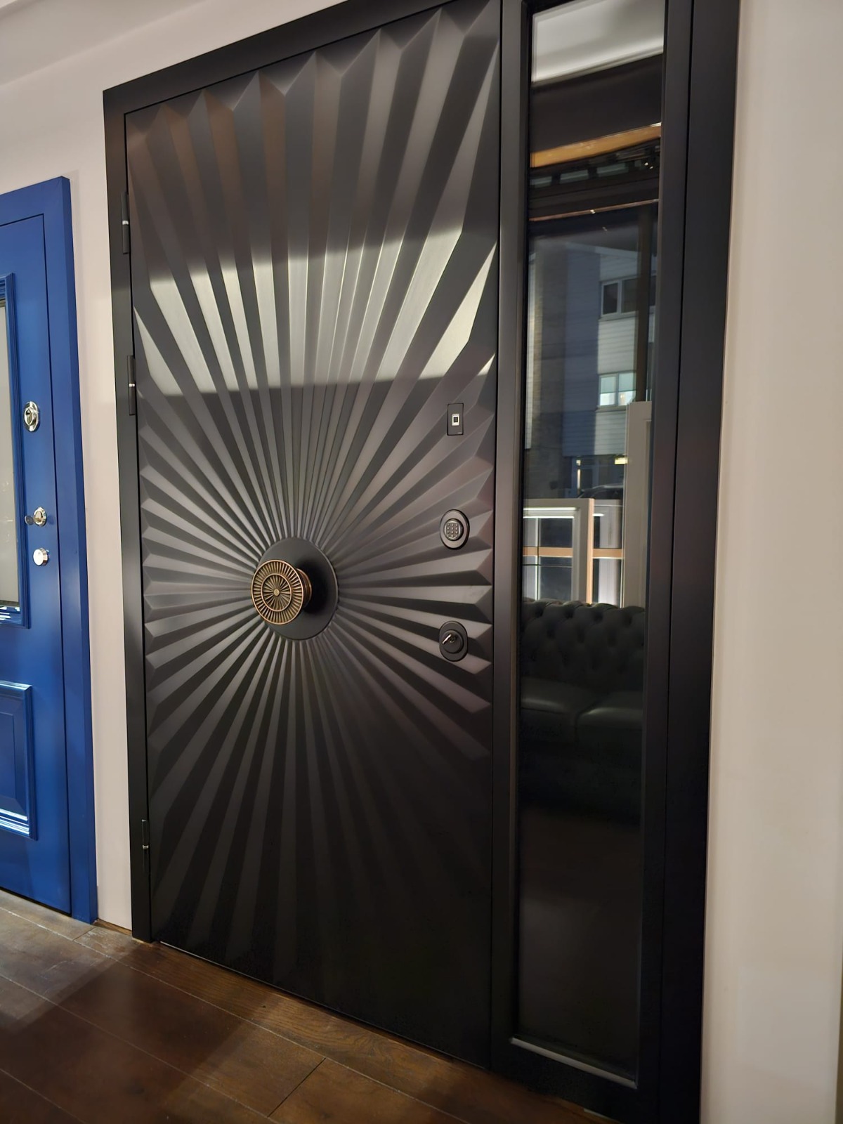 Black contemporary steel door with sunburst design